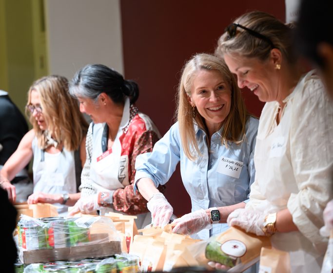 Parents assembling soup kits at PLC Serves